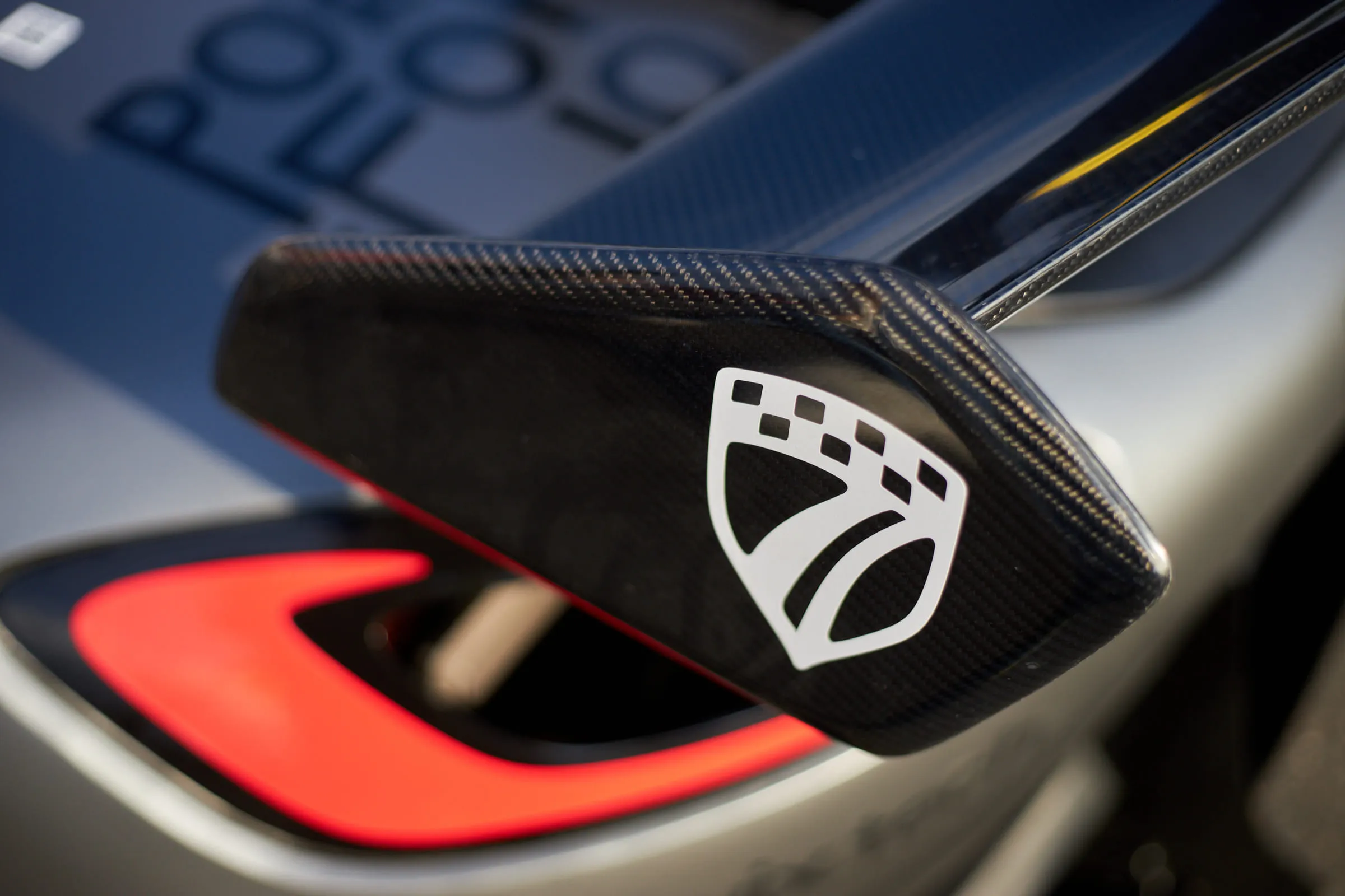 The prototype’s carbon mirror carrying the monochrome Bureau Seven shield