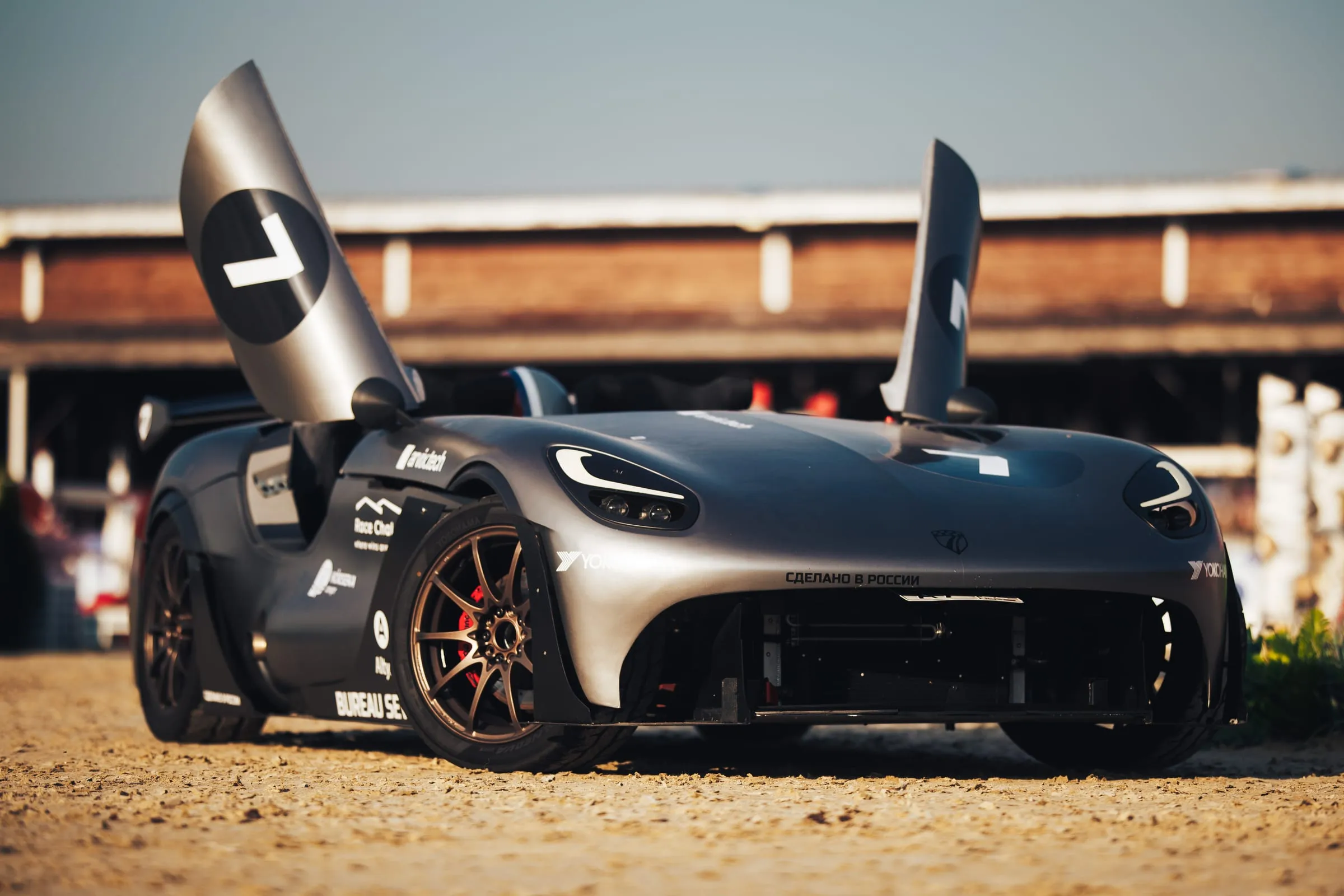 The prototype with its doors raised in the paddock before a start