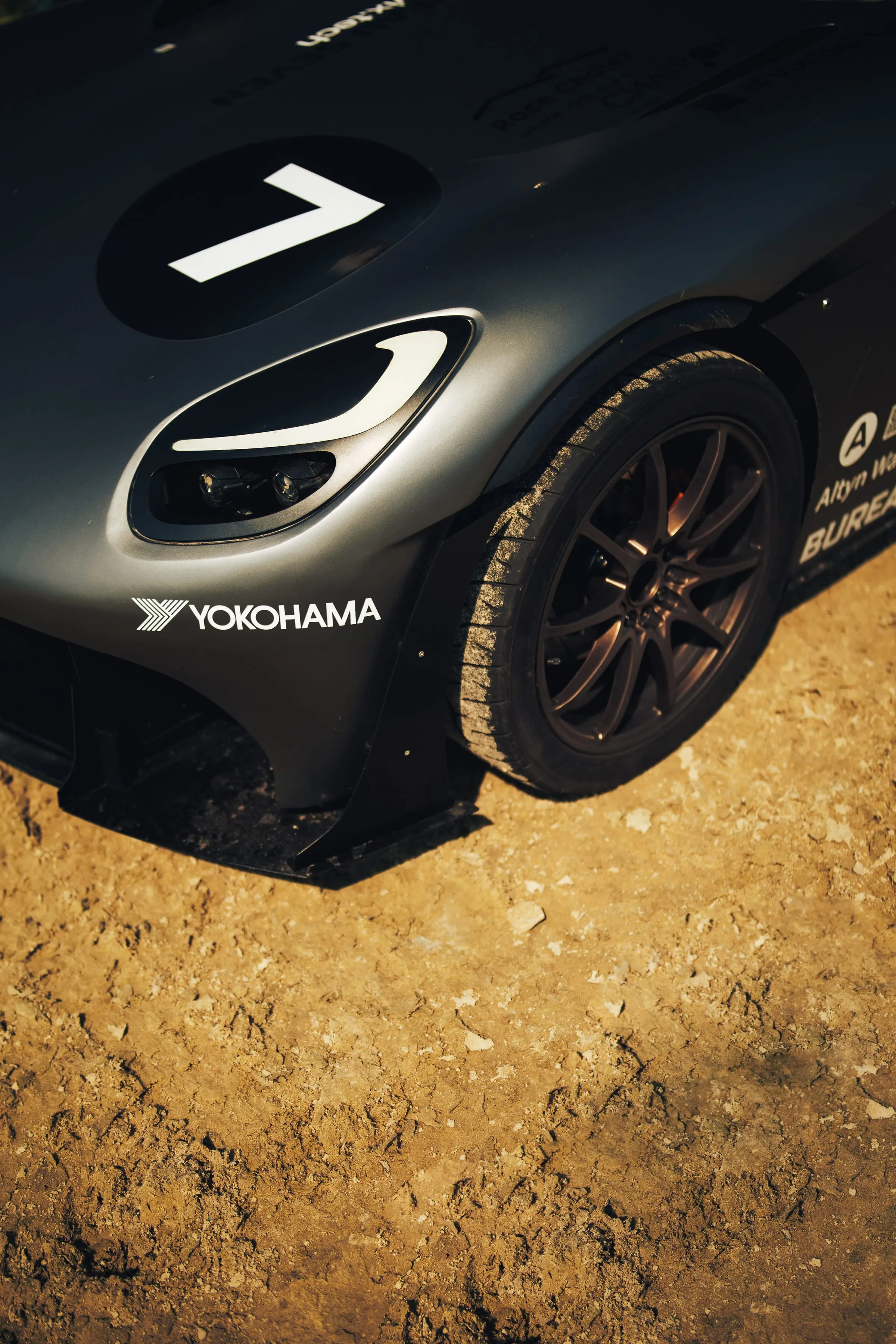 The headlight and front wheel from a low angle