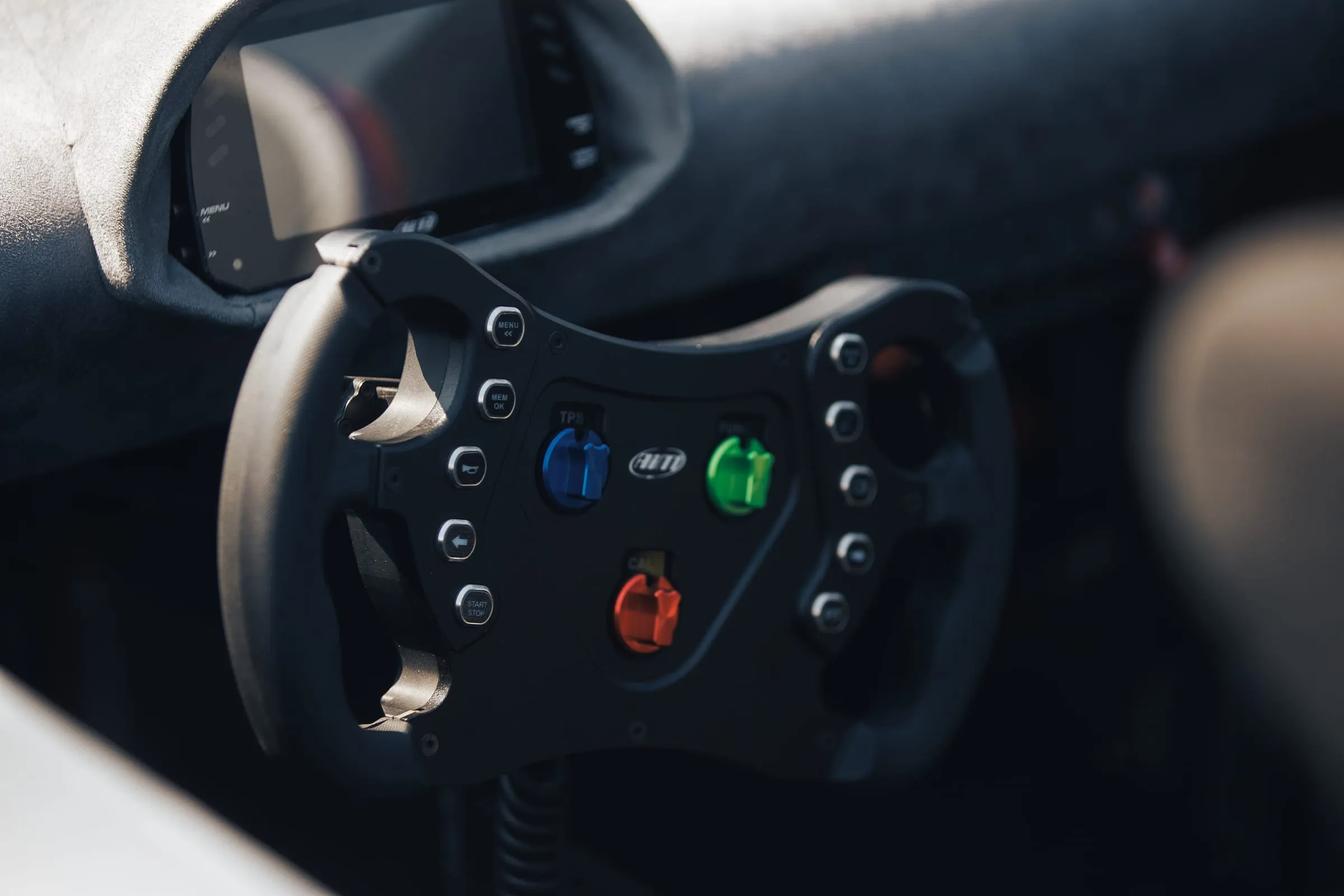 The removable button-laden steering wheel in the cockpit
