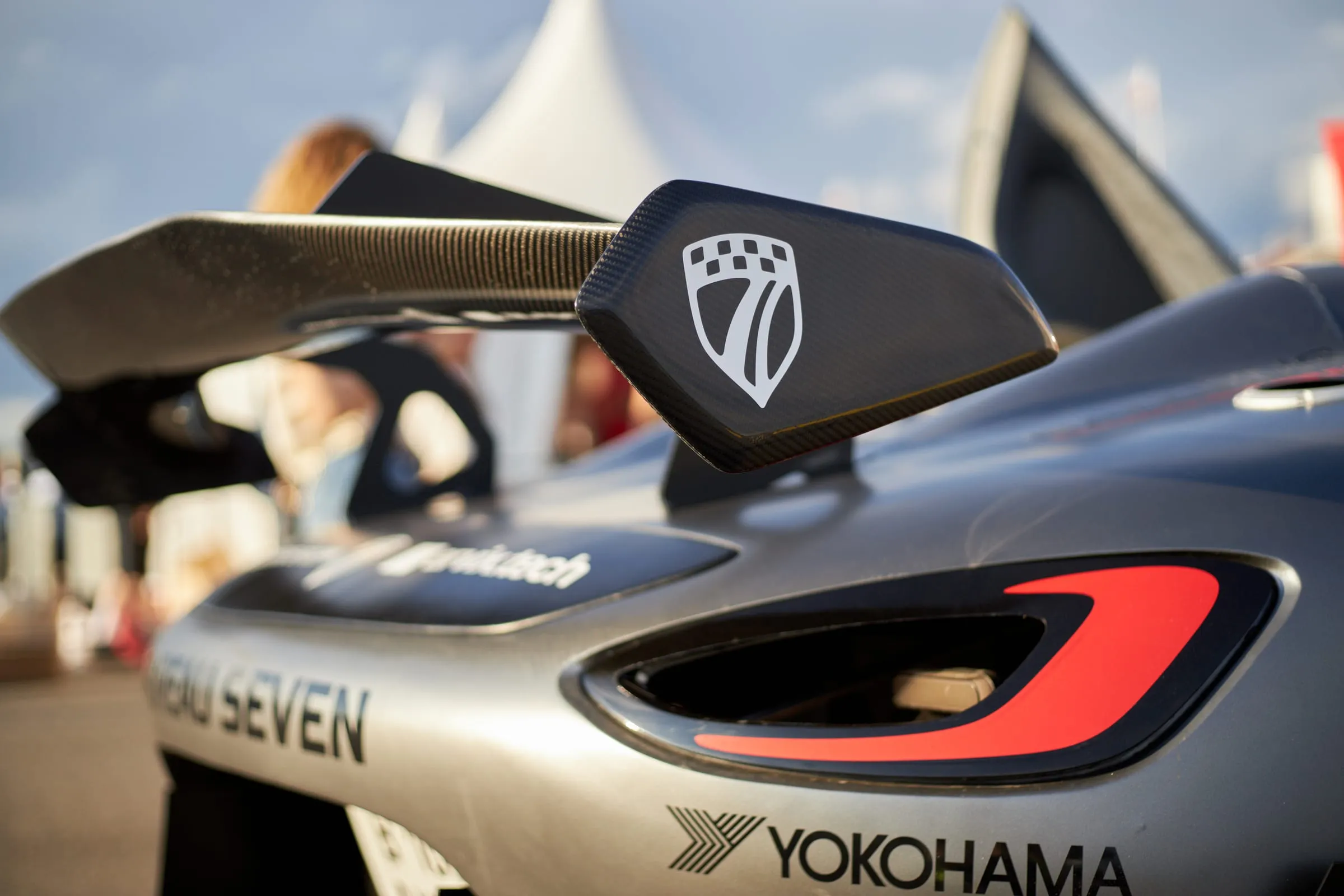 The rear wing and a rear wheel on a Yokohama slick